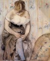 Femme attachant sa jarretière Édouard Manet